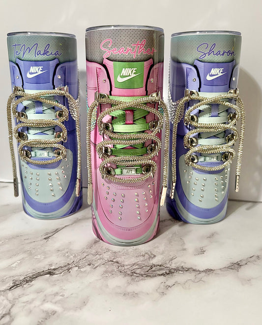 Personalizable 20oz Blinged Out Stainless Steel Thermal Sneaker Tumbler, available in multiple colors. Decorated with Rhinestones and rhinestone coated bling shoe laces. Can be personalized with a name.