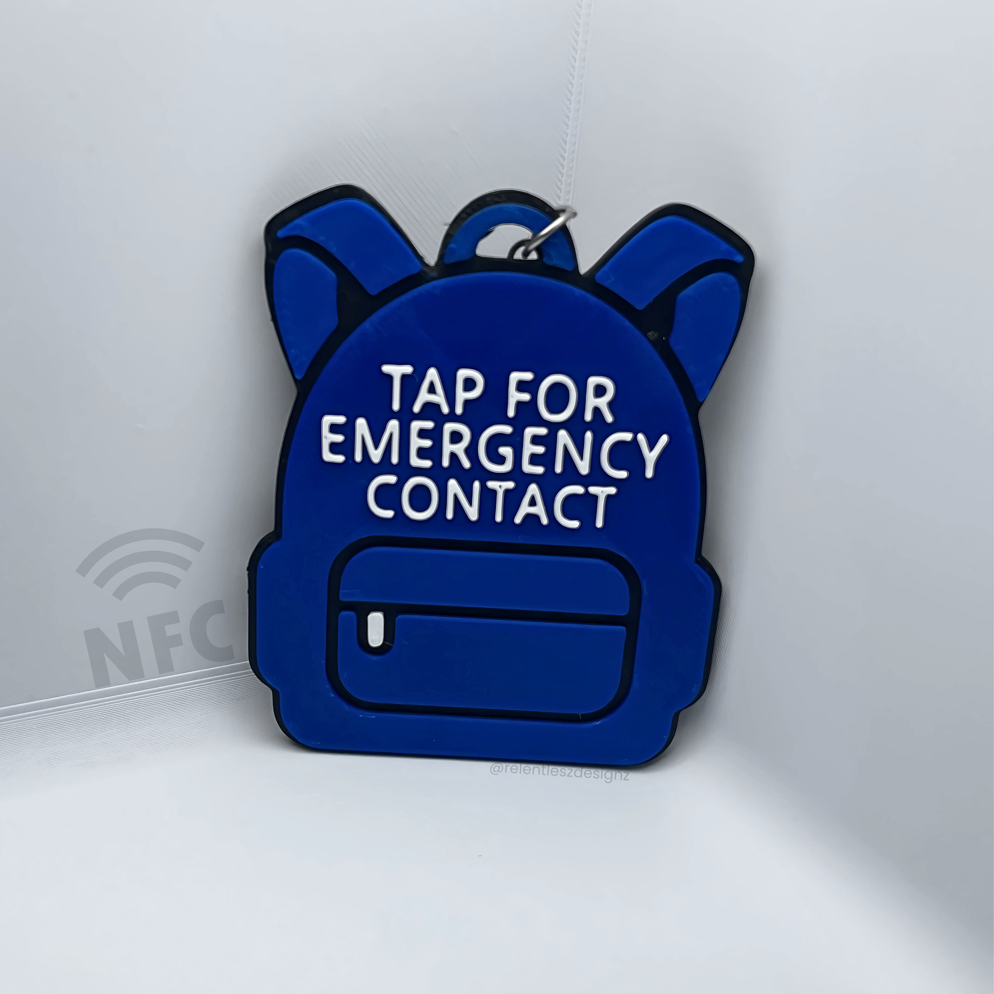 customizable 3D printed backpack NFC emergency tag! Designed in the shape of a cute backpack, this tag allows anyone to simply tap their phone to the tag to access a pre-programmed emergency contact.